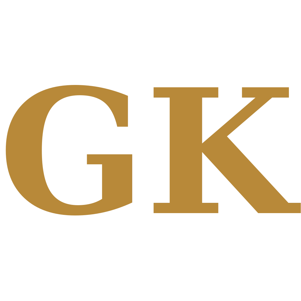 A gold serif monogram of the letters G and K on a white background.
